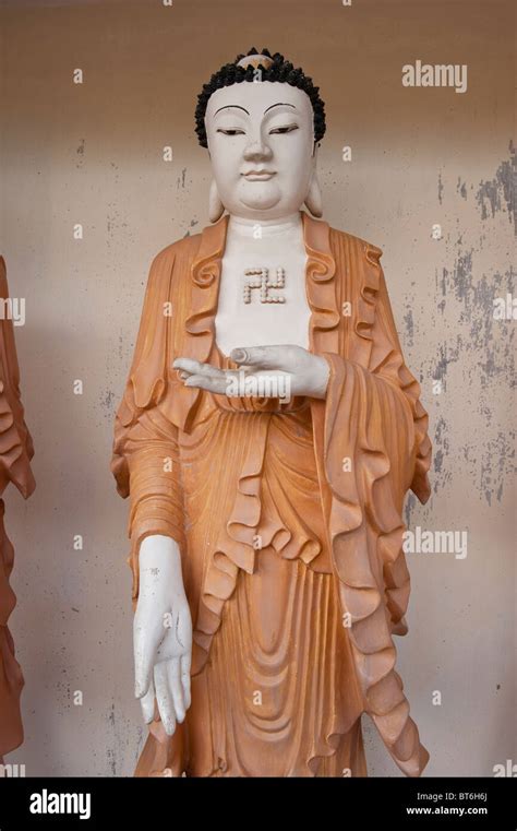 Statue Of Buddha With Buddhist Swastika In Kek Lok Si Temple In Penang