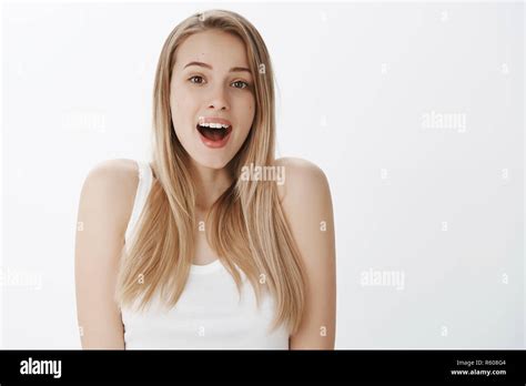 Girl Opens Mouth From Surprise Feeling Amazed And Thankful Friends Made Cool Present Raising
