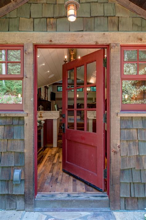 The Red Front Door And Windows Make The Entrance Of This Adorable Cabin