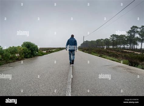 Man Walking Lonely Road Hi Res Stock Photography And Images Alamy
