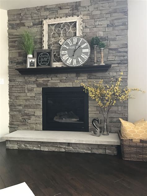 Odds are you will find something you may. My fireplace..Metal Frame, Home sign, & clock (Hobby Lobby ...