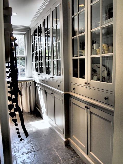 Full view of sleek hallway cupboard with 2 floor to ceiling doors painted white with small steel handles. Are You Making This Common Kitchen Design Mistake? | Floor ...