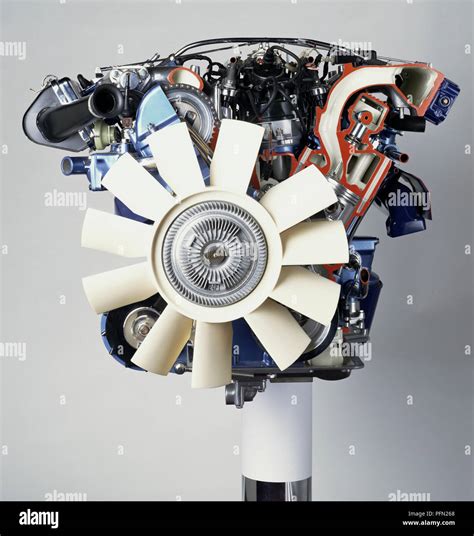 Front View Of A V12 Petrol Engine With White Fan At The Front Stock
