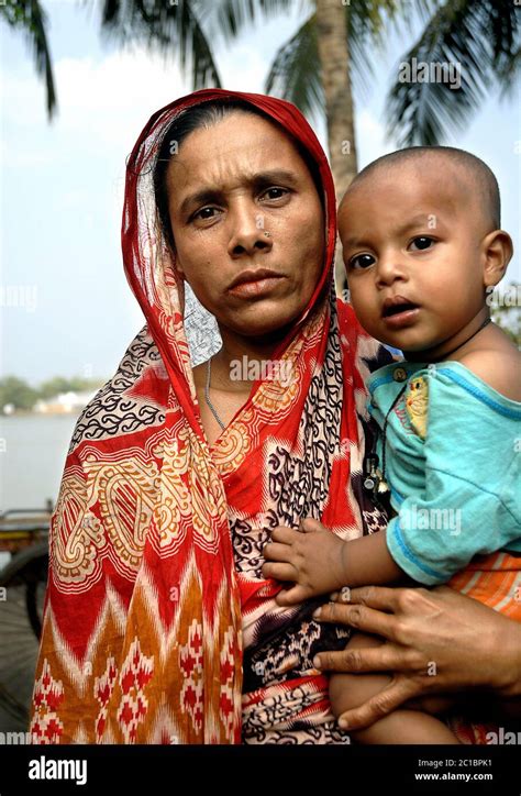 Khulna In Bangladesh Woman In Traditional Clothes Holding A Baby