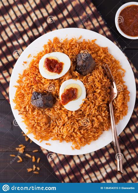 Place eggs in a saucepan or pot and how to cook hard boiled eggs in the pressure cooker. West Africa Rice Jollof With Beef And Boiled Egg Stock ...
