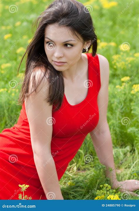 Beautiful Young Woman In Red Dress On Green Grass Stock Photo Image