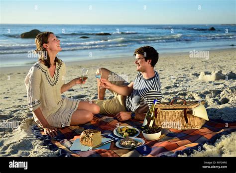Happy Adult Caucasian Couple Having Fun On The Beach Hi Res Stock