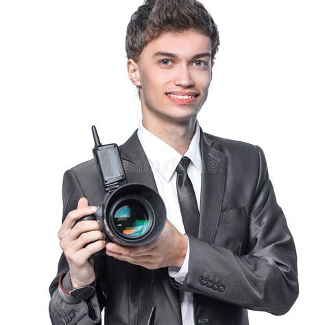 Portrait Of Young Handsome Photographer Holding The Camera Stock Photo