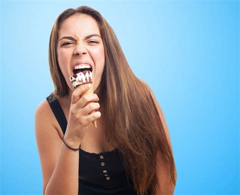 Premium Photo Young Venezuelan Woman Eating An Ice Cream Isolated On Pink Wall Pointing Upside