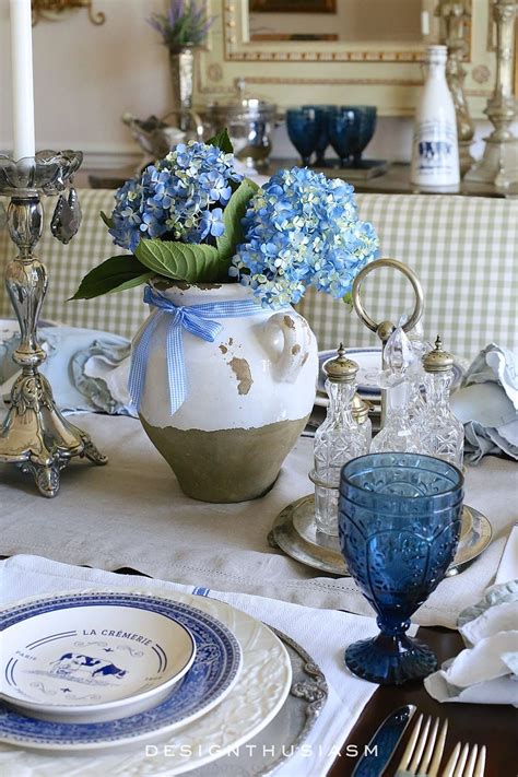 A Country French Table Setting With Blue And White Plates French
