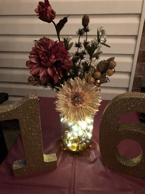 Stacks of vintage books make for great centerpieces, especially if you're going for an antique or eclectic feel. Flower arrangement with fairy lights for sweet 16 birthday ...