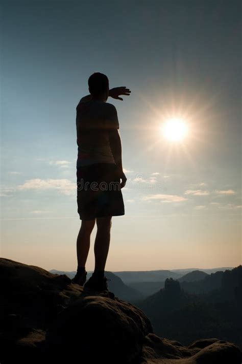 Hiker Stands On Peak Of Rock In Rock Empires Park And Watching Over The