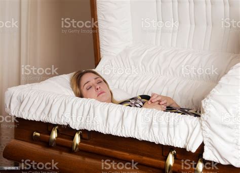 The casket girls got their name from trunks like this one, which they used to transport their belonging to the louisiana colony. Young Woman In A Casket Stock Photo - Download Image Now - iStock