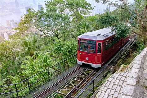 Victoria Peak Tram And Unidentified People With Hong Kong City S Life