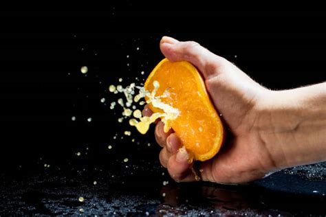 Squeezing Orange Stock Photos Pictures And Royalty Free Images Istock