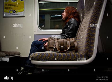 Young Woman Sat On A Train Stock Photo Alamy