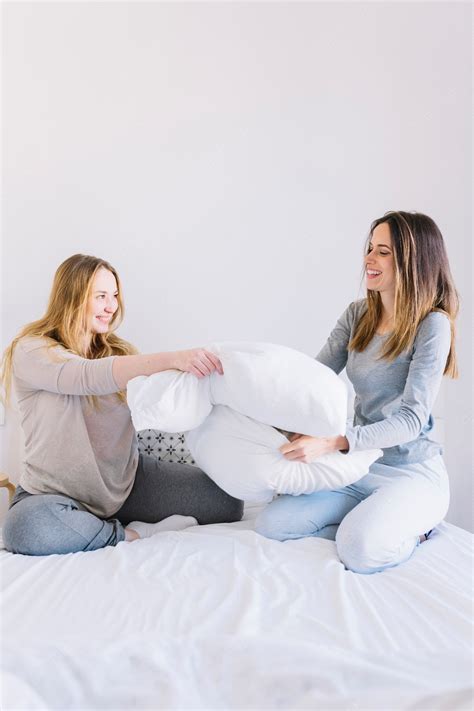 Free Photo Women In Pajamas Fighting With Pillows