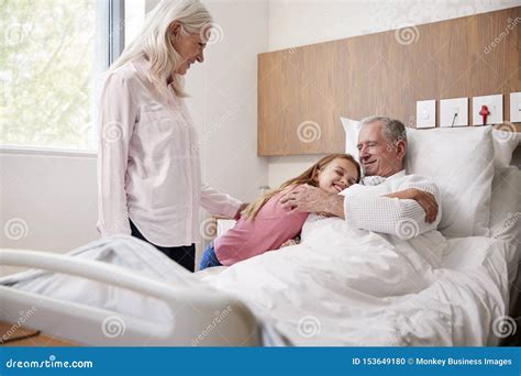 Grandbabe Hugging Grandfather On Family Hospital Visit Royalty Free Stock Image