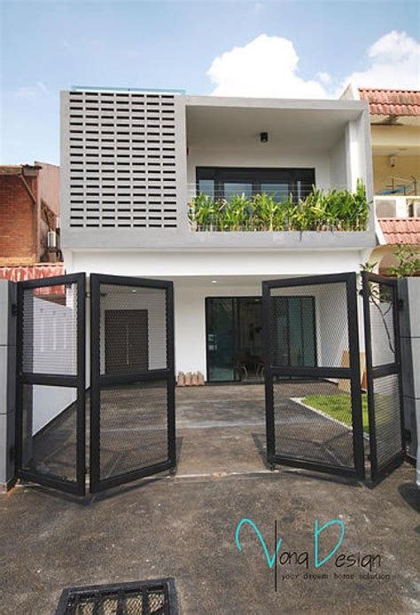 Colour and texture from the street, double storey house design can appear flat and monolithic. Yong Studio Sdn Bhd - Simple yet fascinating terrace house ...