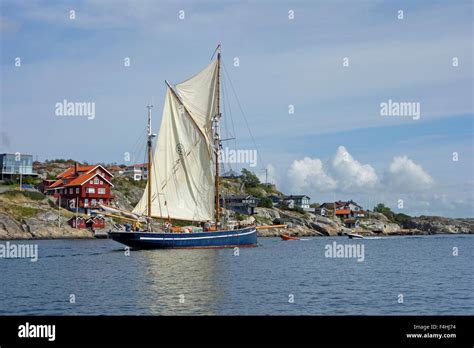 Two Masted Schooner Sails Past By Hjuvik Coast On Swedish West Coast