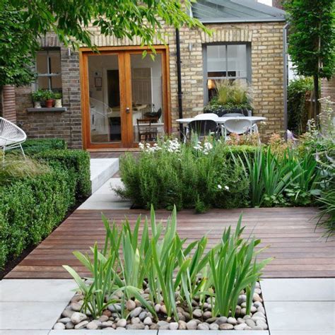 Break Up Your Garden With Decking Concrete And Decorative Stones For A
