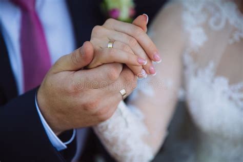 Closeup Groom And Bride Are Holding Hands At Wedding Day Ang Show Rings Concept Of Love Family