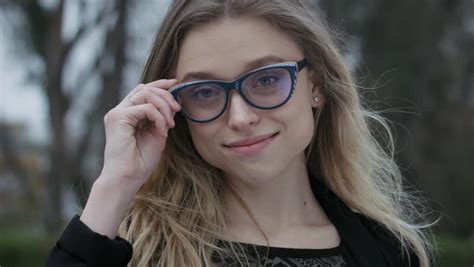 Beautiful And Cute Girl With Glasses Talking Through The