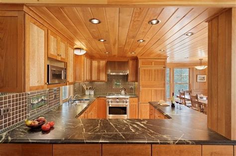 Country Kitchen Featuring A Lot Of Wood Small House Design Exterior