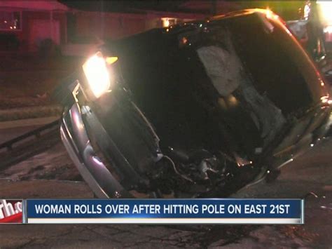 woman crashes into pole causes rollover