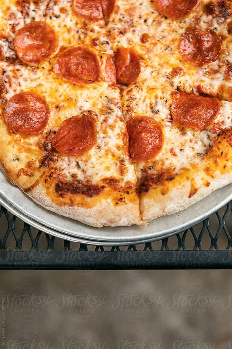 Dining Overhead Of Pepperoni Pizza On Tray By Stocksy Contributor