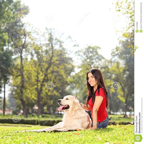 Beautiful Girl Sitting On The Grass With Her Dog Stock Image Image Of