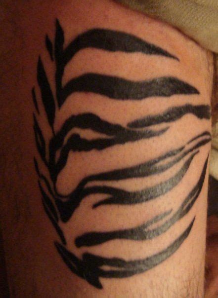 Tiger tattoos often represent power, protection. Tiger stripe tattoo, Stripe tattoo, Tiger skin