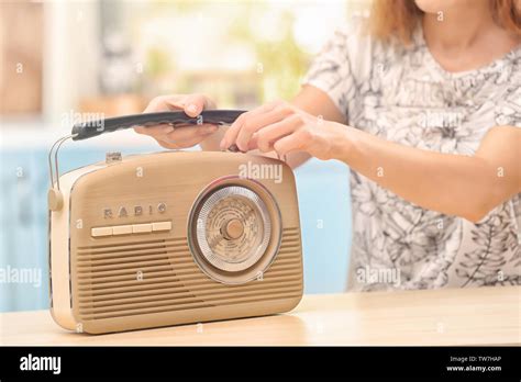 Young Woman Listening To Radio In Kitchen Stock Photo Alamy