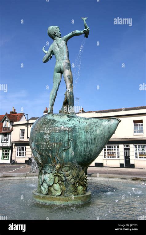 Bronze Fountain Of A Young Boy Holding Fish With Sea Lions Around The