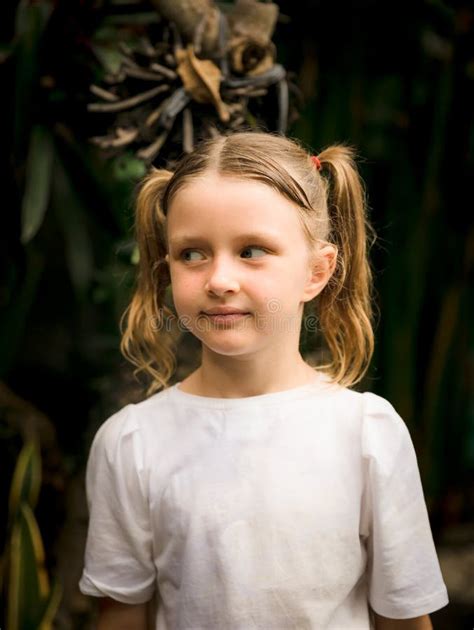 Close Up Portrait Of Pretty Little Girl Blue Eyes And Blond Hair