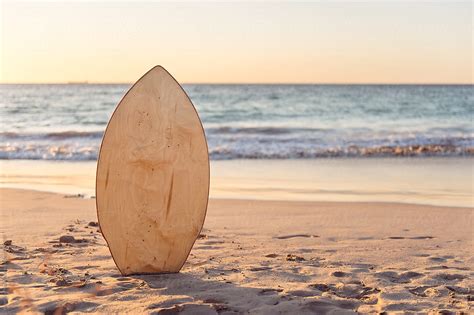 Skim Board In The Sand At The Beach At Sunset By Angela Lumsden