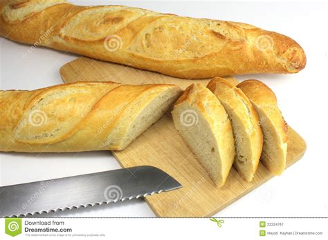 Sliced Fresh Baguette And Bread Knife Royalty Free Stock