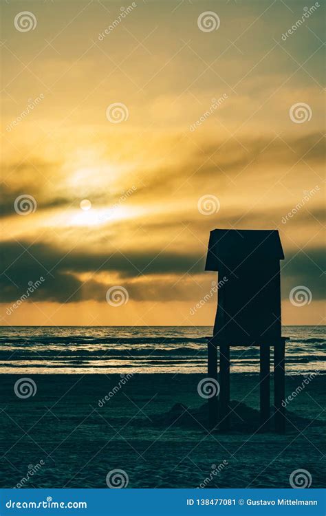 Lifeguard Tower Silhouette And Yellow Sunrise Stock Image Image Of