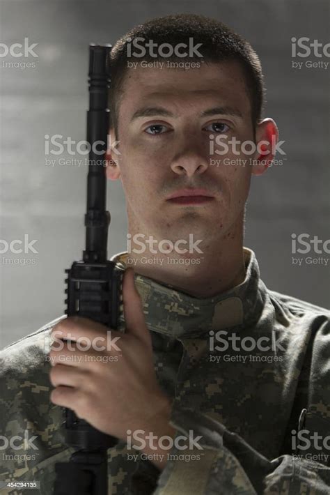 Young Military Man With Assault Rifle Vertical Stock Photo Download