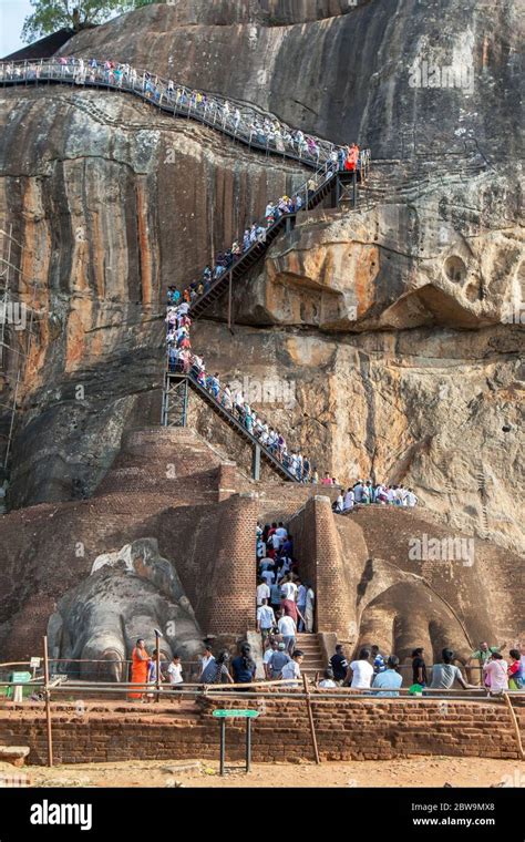 A Stream Of People Climb The Stairway From The Lion Platform Towards