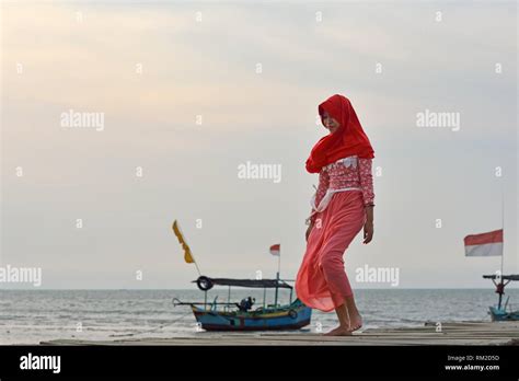 Young Woman Walking On A Pontoon At Karangjahe Beach Near Lasem Java