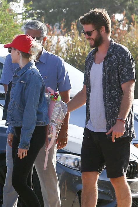 miley cyrus and liam hemsworth on a road trip as she is photographed with new ring on her finger