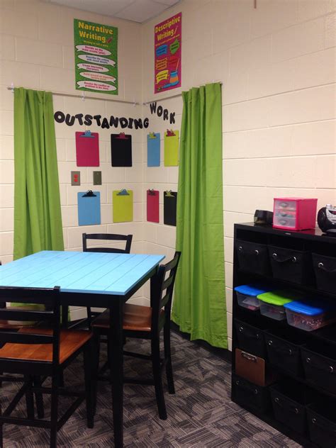 Writing Center With Tall Table And Clipboards To Display Student Work