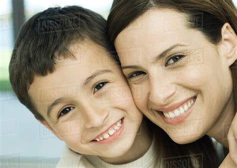 Mother And Son Smiling Cheek To Cheek Stock Photo Dissolve
