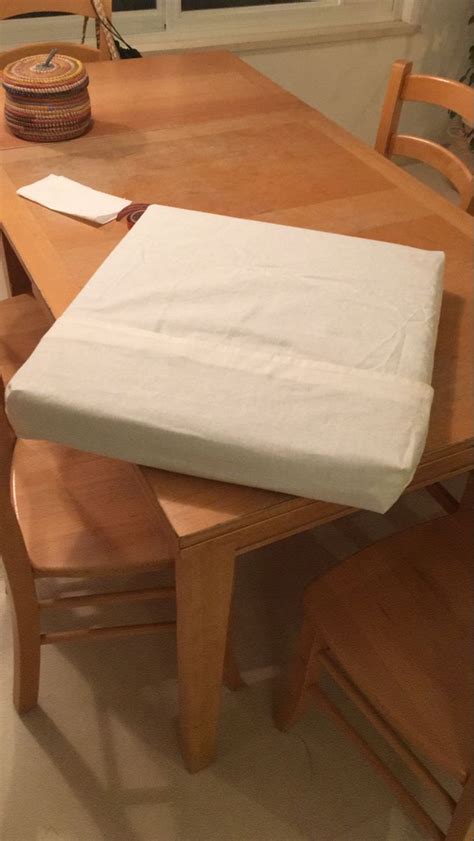 A Wooden Table With A Mattress On Top Of It