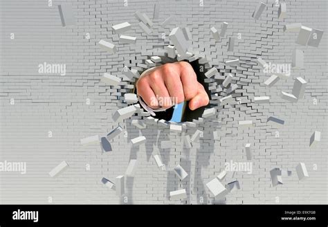 Fist Punching Through Brick Wall Stock Photo Alamy