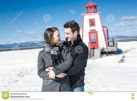Couple In Winter Snow Scene At Beautiful Sunny Day Stock