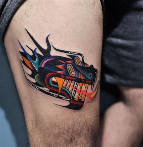 The tattoo features black ink roses with charms that are placed high on the hip and thigh. Abstract colorful tattoo on the thigh - Tattoogrid.net
