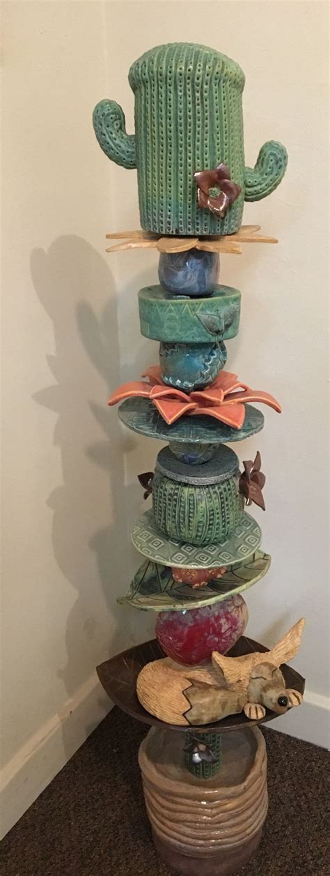 How to make ceramic garden totems. Student work | Pottery art, Totem pole art, Ceramic art