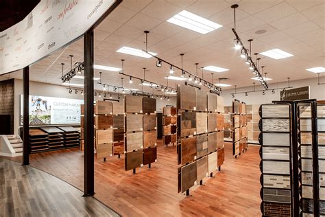 Our studio is made up of a diverse and international team with different cultures, languages and architectural training. Environmental Graphic Design - JP Flooring | White Design ...